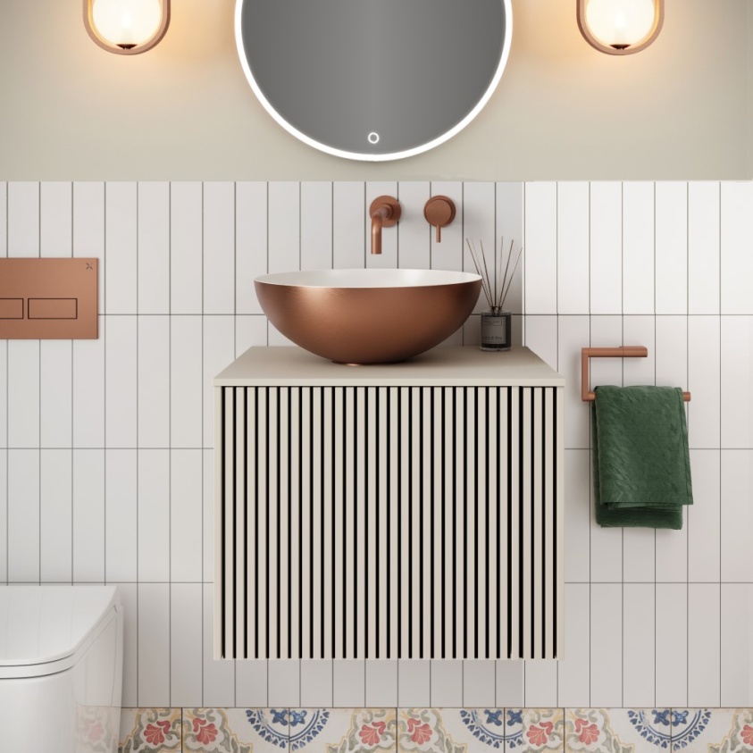 Product lifestyle image of Crosswater Limit 500mm Warm Stone Wall Hung Vanity Unit and Worktop with bronze countertop bowl basin fitted to white tiled wall LM5000DWSAN LM5100TWS